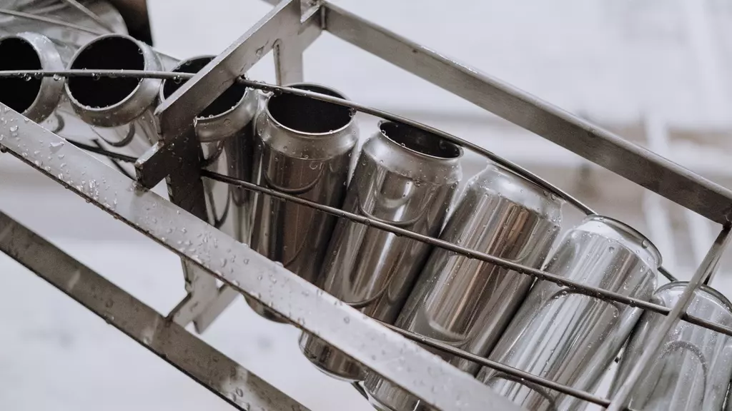 Cans being conveyed through a manufacturing plant