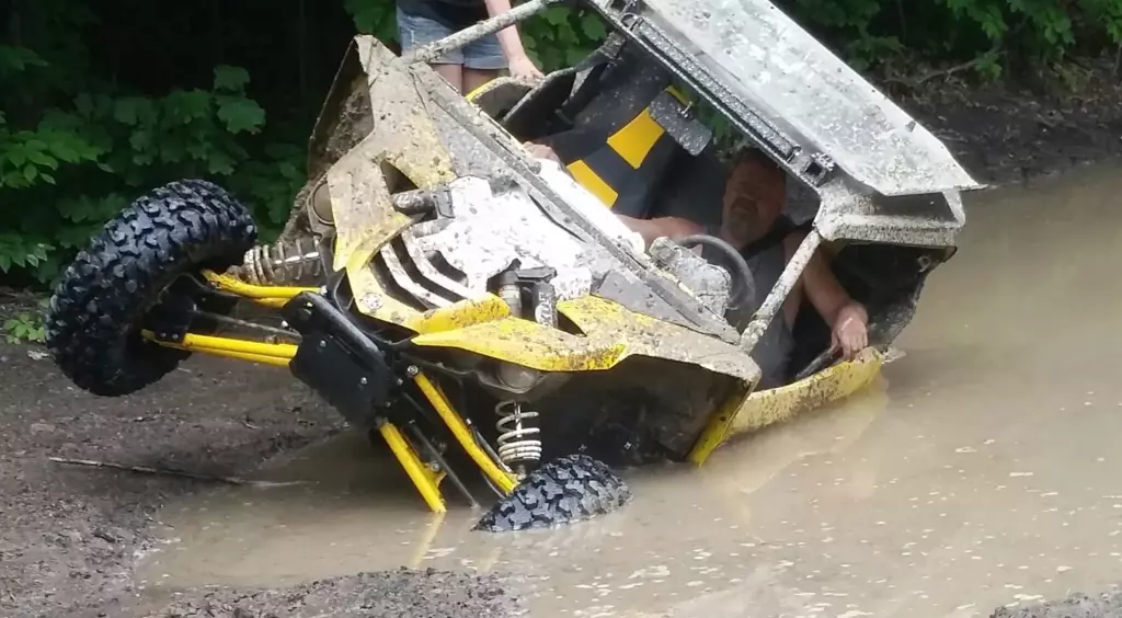 Jason Gunar in the mud in his UTV